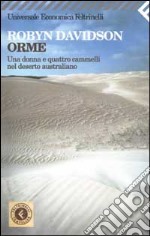 Orme. Una donna e quattro cammelli nel deserto australiano