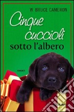 Cinque cuccioli sotto l'albero libro