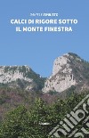 Calci di rigore sotto il monte finestra libro