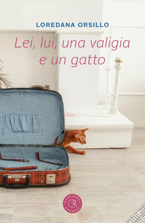 Lei, lui, una valigia e un gatto