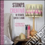 Stampa creativa su tessuto, carta e legno libro