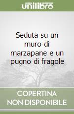 Seduta su un muro di marzapane e un pugno di fragole