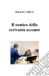 Il nemico della scrivania accanto libro di Marzi Massimo