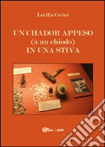 Un chador appeso (a un chiodo) in una stiva libro