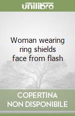 Woman wearing ring shields face from flash