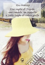 Una voglia di fragola, una candela, un cappello a falde larghe di colore giallo libro